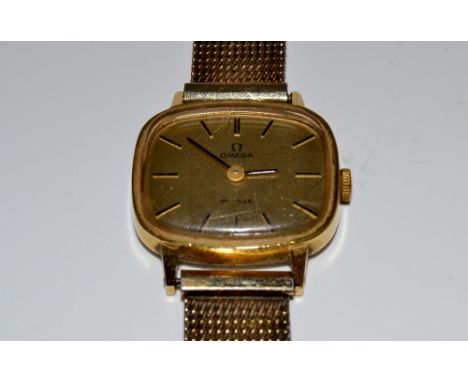 A lady's Omega De Ville wrist watch, gilt dial, baton markers, manual wind movement, serial 5110413, original Champion strap