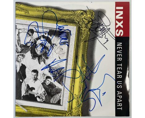 A copy of INXS - Never Tear Us Apart, signed to front of sleeve by Michael Hutchence, Kirk Pengelly, Jon Farriss, Gary Gary B