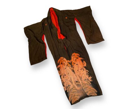 A Japanese kimono with ornate floral pattern, owned by John Deacon, who brought this home from Queen's 1975 tour of Japan. Th