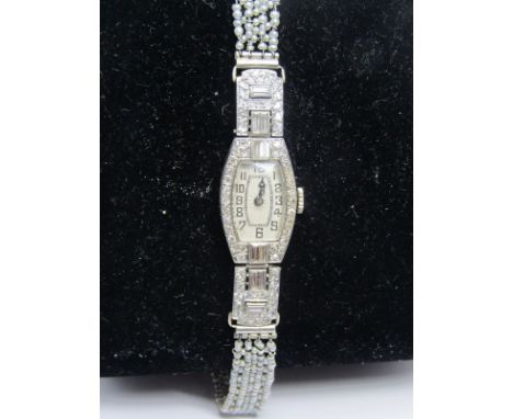 PLATINUM DIAMOND &amp; PEARL SET LADIES COCKTAIL WATCH of Art Deco design, appears in good working condition 