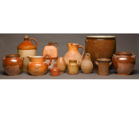 Miscellaneous saltglazed brown stoneware jugs, jars and flagons, mid 19th c and later and an ochre dip glaze sandy buff earth
