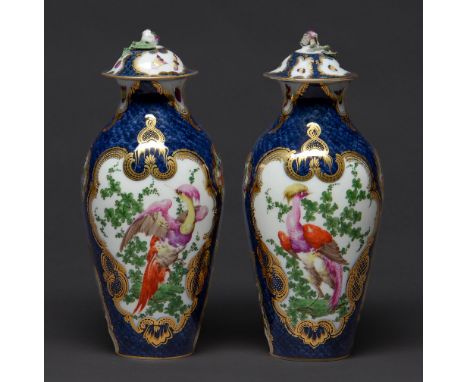 A pair of Continental scale blue ground 'Worcester' vases and covers, late 19th / 20th c, decorated with&nbsp; 'dishevelled' 