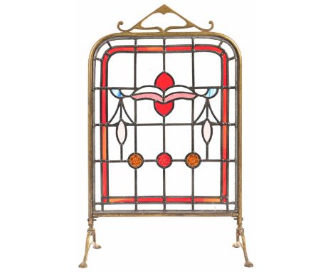 An Edwardian brass framed leaded glass firescreen,&nbsp;61cm h and a set of three early 20th c leaded glass door or window li