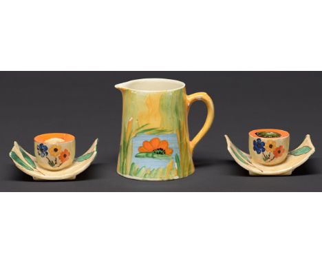 A pair of Myott, Son &amp; Co art deco earthenware candlesticks, c1936, painted with flowers, 95mm l, printed mark and a cont