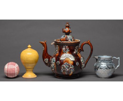 A Staffordshire silver resist lustre decorated pale blue earthenware jug, c1810, 11.5cm h, an English yellow ochre slipware b