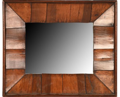A walnut mirror,&nbsp;in rectangular mahogany frame, 31.5 x 37cm  Made up from a Victorian mahogany box frame, the walnut ele