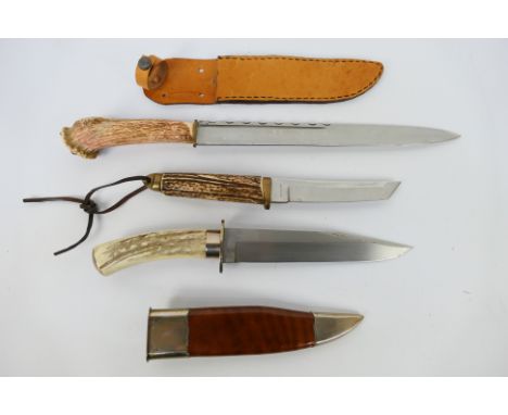 Three knives, each with antler grip, largest with 30.5 cm (l) blade, two contained in sheaths. [W]Note: This lot is not for s