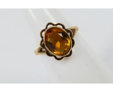 A hallmarked 9ct yellow gold ring set with one oval cut citrine, size K, approx weight 2.3 gm (all in)