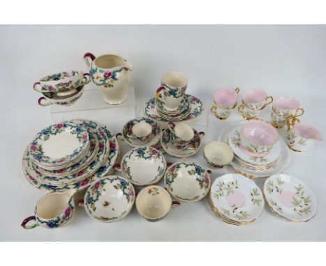 A quantity of Royal Cauldon dinner and tea wares in the Victoria pattern and a boxed 21 piece Royal Albert tea service in the