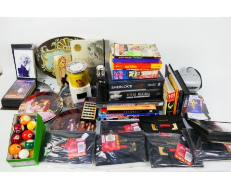 A mixed lot comprising various publications to include music related, television and similar, hip flask, purses, fairytale co