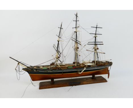 Model Ship - A three masted barque mounted to plinth, approximately 55 cm x 79 cm. [W]NOTE: THIS LOT IS NOT AVAILABLE FOR IN 