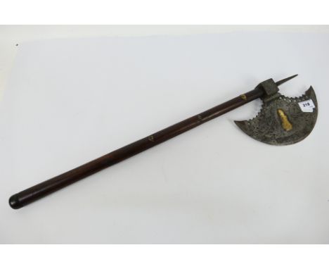 A late 19th or early 20th century Indian tabar or axe with foliate decorated, crescentic iron head with gilt highlights, cube