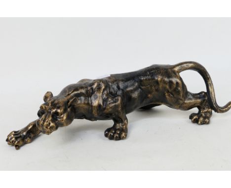 A bronzed cast iron model depicting a panther, approximately 40 cm (l). [W]