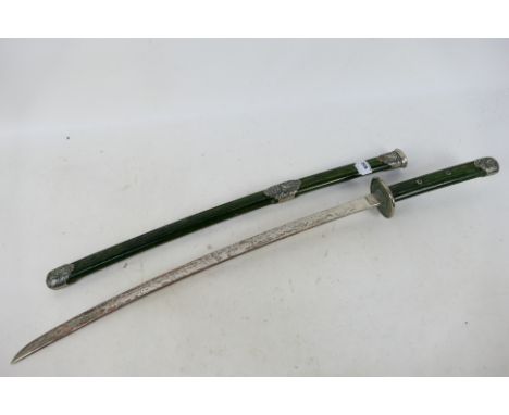 A vintage katana, 64.5 cm (l) blade with white metal mounted scabbard. [W]Note: This lot is not for sale to people under the 