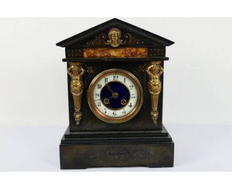 A late 19th/ early 20th century French black marble mantel clock, the case of architectural form decorated with cast brass cl