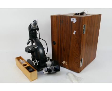 A Vickers Instruments M70 binocular microscope contained in fitted case with accessories. [W]