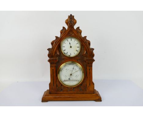 A vintage clock / barometer in wooden case, the case believed to be carved from a yew church pew, 41 cm (h). [W]