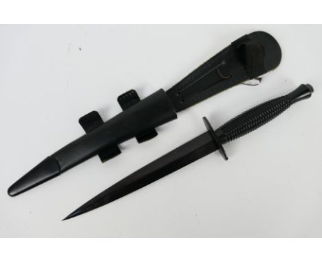 A modern third pattern commando knife by J Nowill & Sons Sheffield, blackened 17.5 cm (l) blade, maker's mark and broad arrow