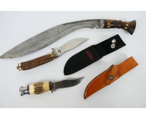 A William Rodgers I Cut My Way knife in sheath, a similar Colt knife and a vintage Kukri with bone inlaid wooden handle. [W]N