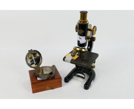 A W R Prior & Co London black lacquer and brass monocular microscope and a compass marked Stanley London, contained in wooden