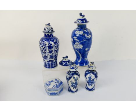 A group of 19th Century blue and white Chinese pottery covered vases of varying heights ranging from 17cm to 28 cm (high), al