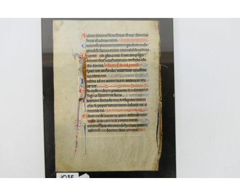 An illuminated manuscript page of Latin text, 20 lines, framed, page approximately 24 cm x 17 cm. [W]