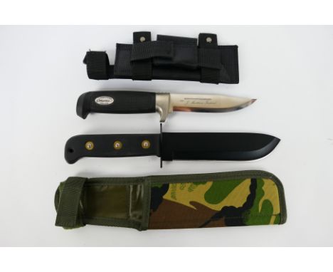 Two knives comprising a J Marttiini, Finland example and one other, both contained in sheaths. [W]Note: This lot is not for s