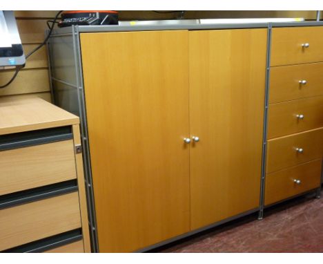 An ultra modern metal and light wood storage system, similar good home office furniture and a paper shredder E/T