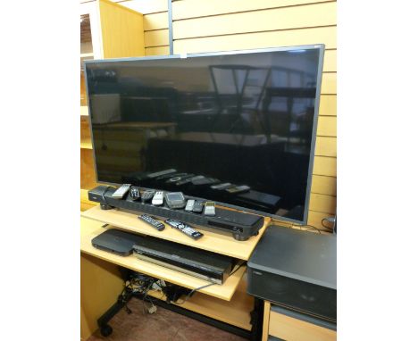 A Samsung curved flatscreen TV mod UE55J586002, Yamaha digital sound projector YSP2200, a Panasonic Blueray player and a Yama