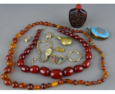 Two amber type sets of beads and a snuff bottle, a Victorian enamel and seed pearl set locket, a Longines ladies wristwatch a