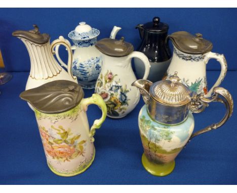 Collection of mainly Victorian transfer decorated jugs and a blue and white decorated teapot