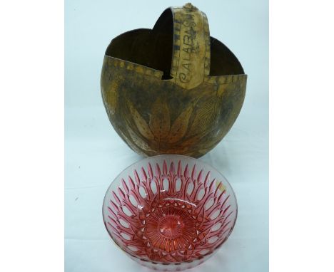 Primitive carved nut basket and a ruby red glass bowl