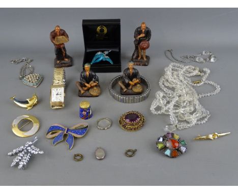 A set of four composition figures oriental workers, a selection of vintage costume jewellery including a miracle brooch, an e