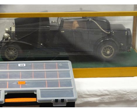 Large scale cased model of a 1932 Rolls Royce Phantom II coupe, a pictorial image of a Rolls Royce mascot and a cased quantit