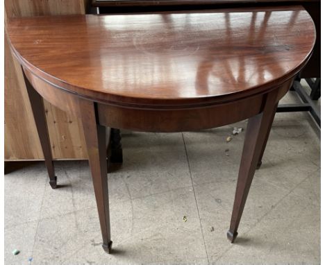A 19th century mahogany card table, the foldover top with a baize interior on square tapering legs and spade feet
