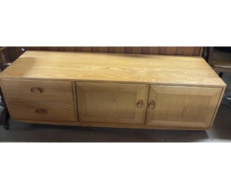 An Ercol side cabinet, with a rectangular top above two drawers and two cupboards, 156cm wide x 44cm deep x 49cm high  CONDIT