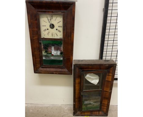An American walnut framed wall clock, together with another wall clock