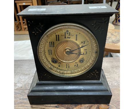 An Ansonia Co. simulated black slate mantle clock, with a gilt dial and Arabic numerals, 26cm high 