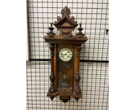 A walnut cased Vienna regulator type wall clock
