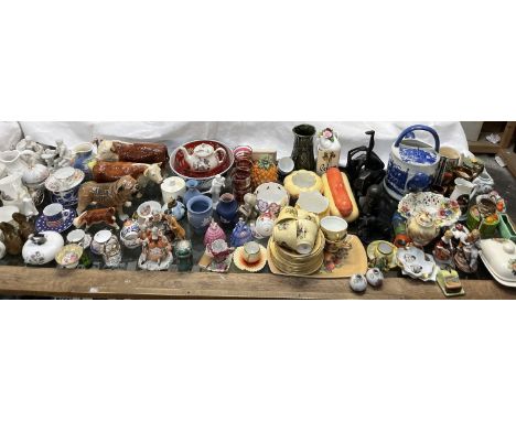 Pottery bulls together with a pottery bulldog, an Aynsley Orchard Gold part tea service, mugs, cups and saucers, copper luste