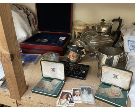 Assorted coin sets together with an electroplated part tea set, Royal Doulton spirit flask, pot lid etc 