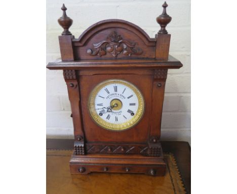 A Thomas Fattorini Bugler alarm clock in an oak case - 44cm H - in clean running order 