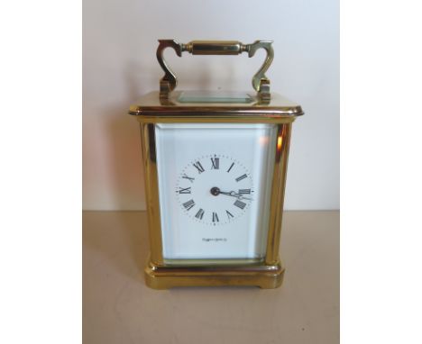 A Mappin and Webb carriage clock with Roman numeral dial, approximately 13.5cm high, 11cm wide, 8.5cm deep, in a clean condit