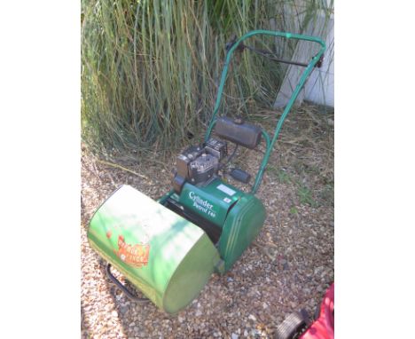 A Qualcast petrol 14 S cylinder mower with associated grass box, from a deceased estate so not recently used 