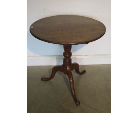 A Georgian oak tilt top side table on tripod base, 71cm H x 71cm Diameter 