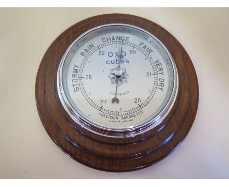 A mahogany case anoroid barometer 6 inch silvered dial, chrome bezel 