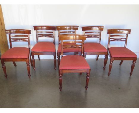 Six mahogany frame chairs with fluted legs and upholstered drop in seats, some areas of light wear to frames 