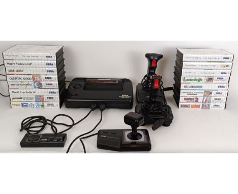A vintage Sega Master System II games console, with various controllers and games, PGA Tour Golf, Champions Of Europe, World 