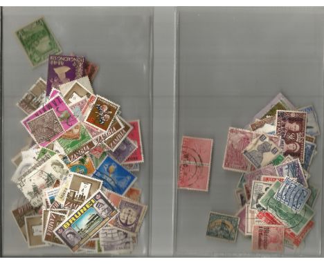 British Commonwealth stamp collection accumulation stamps on paper in two bags a lot of items over 50 years old. Good Conditi