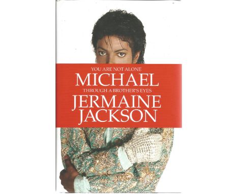Jermaine Jackson signed hardback book titled You Are Not Alone Michael Through His Brothers Eyes signature on the inside titl